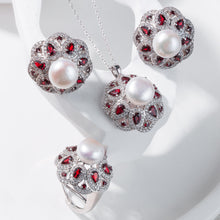 Qalereya görüntüsünə şəkil yükləyin, Jewelry set with pearls and red gemstones on a white background
