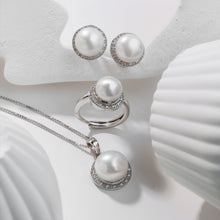 Qalereya görüntüsünə şəkil yükləyin, Pearl jewelry set including earrings, ring, and pendant on a white background
