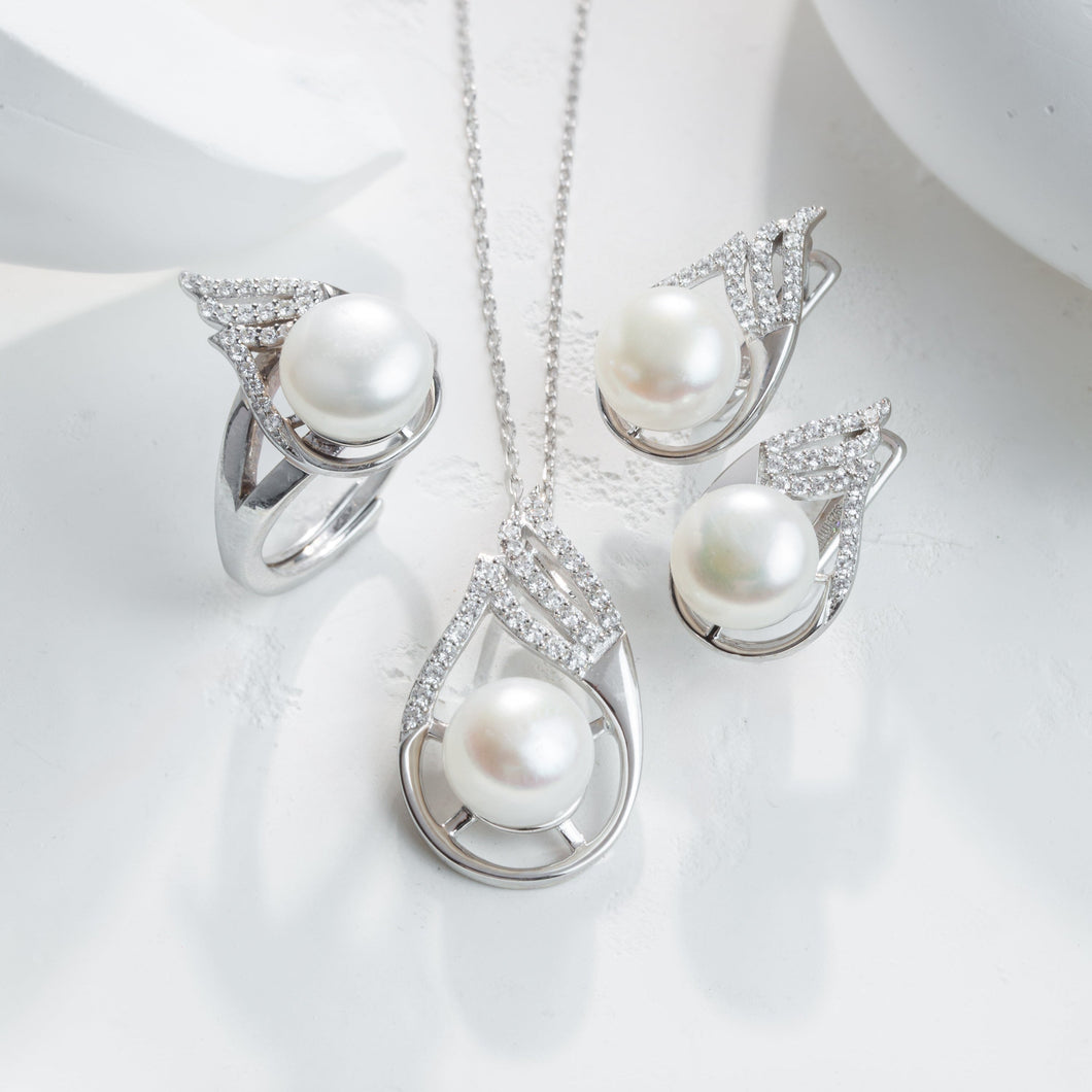 Pearl necklace and earrings set on a white surface