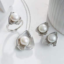 Qalereya görüntüsünə şəkil yükləyin, Pearl jewelry set with necklace and earrings on a white background
